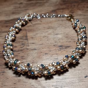 Gold and silver bracelet with small crystals